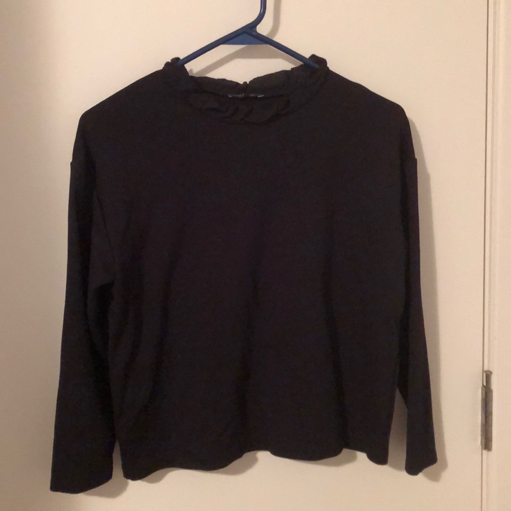 Black blouse with neckline ruffles